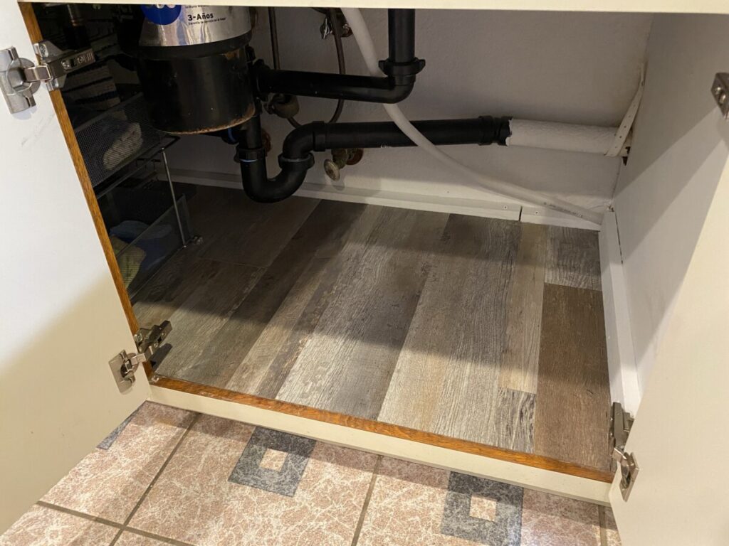 Kitchen sink cabinet with replaced floor - right side