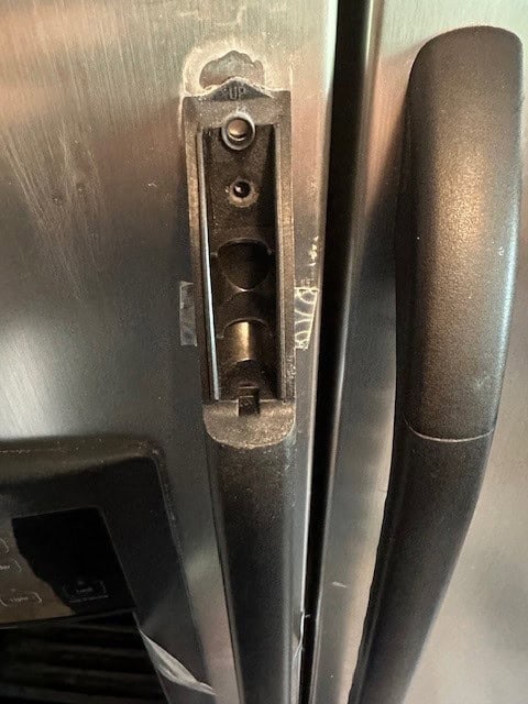 GE fridge handle cover removed