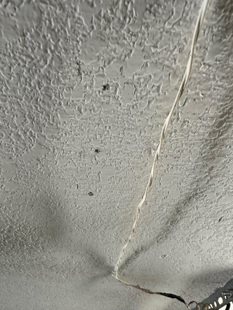 Garage ceiling marked for retractable cord reel ceiling mount