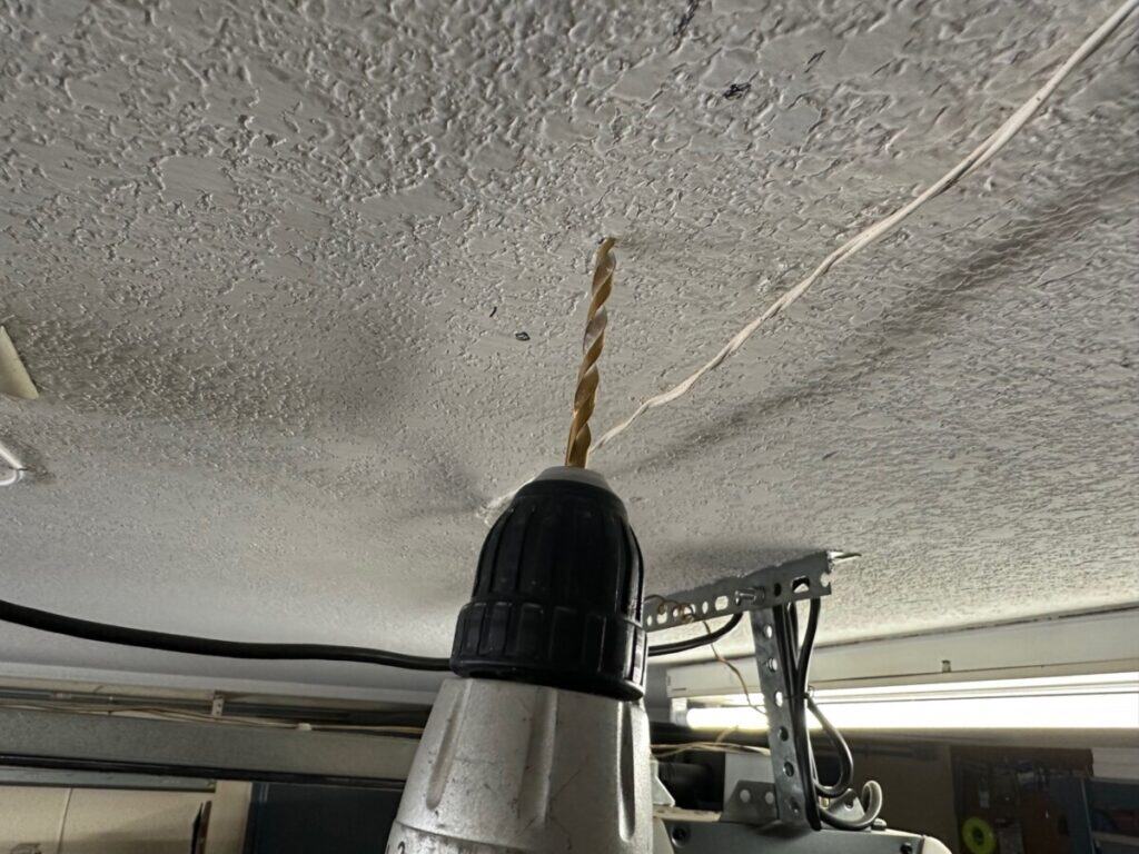 retractable cord reel pilot holes